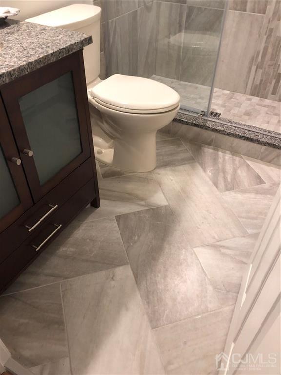 564 B Ardmore Road Monroe Township, NJ 08831 - Photo 12 of 26 a bathroom with a granite countertop toilet and a sink