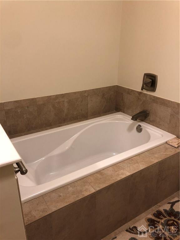 564 B Ardmore Road Monroe Township, NJ 08831 - Photo 19 of 26 a bathroom with a bathtub