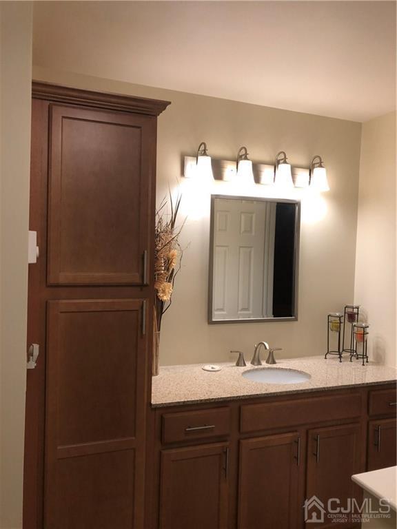 564 B Ardmore Road Monroe Township, NJ 08831 - Photo 20 of 26 a bathroom with a double vanity sink and mirror