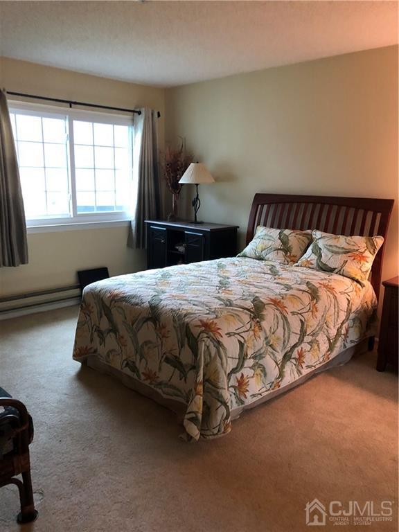 564 B Ardmore Road Monroe Township, NJ 08831 - Photo 21 of 26 a bedroom with a bed and window