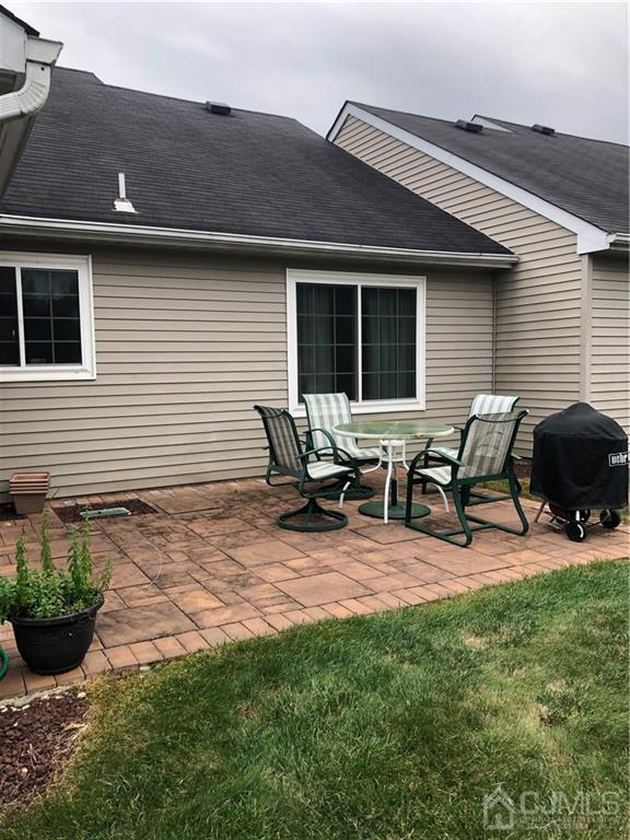564 B Ardmore Road Monroe Township, NJ 08831 - Photo 24 of 26 a view of a backyard with a patio and outdoor seating