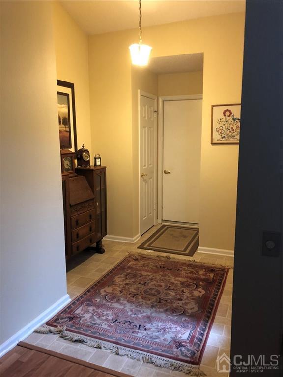 564 B Ardmore Road Monroe Township, NJ 08831 - Photo 3 of 26 a view of a hallway with wooden floor