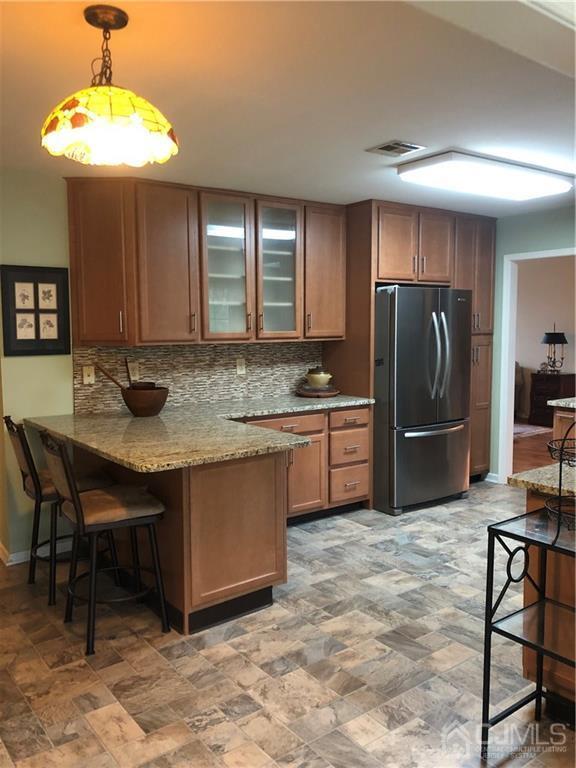 564 B Ardmore Road Monroe Township, NJ 08831 - Photo 7 of 26 a kitchen with stainless steel appliances granite countertop a sink refrigerator and cabinets
