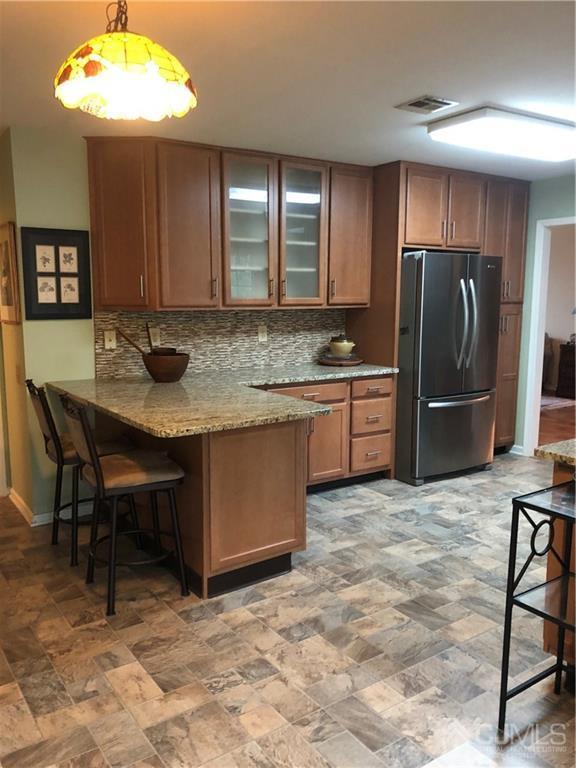 564 B Ardmore Road Monroe Township, NJ 08831 - Photo 8 of 26 a kitchen with stainless steel appliances granite countertop a sink and a refrigerator