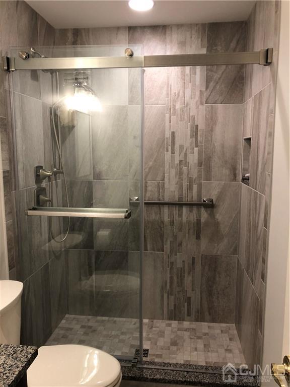 564 B Ardmore Road Monroe Township, NJ 08831 - Photo 10 of 26 a bathroom with a shower and a toilet