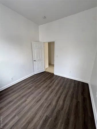 an empty room with wooden floor