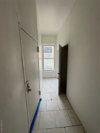 a view of an empty room with windows