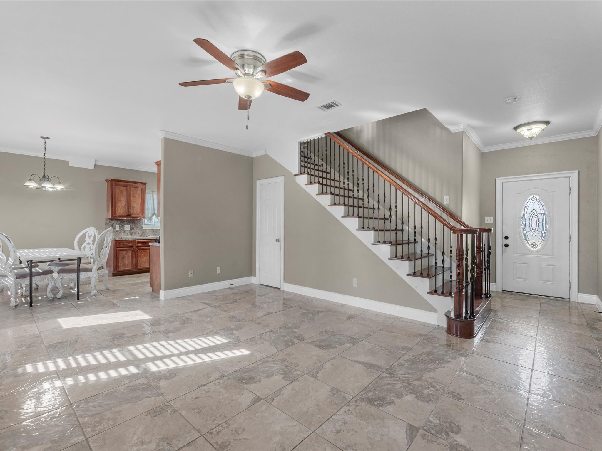 8906 Intervale Street Houston, TX 77075 - Photo 4 of 21 a view of entryway and hall with dining room