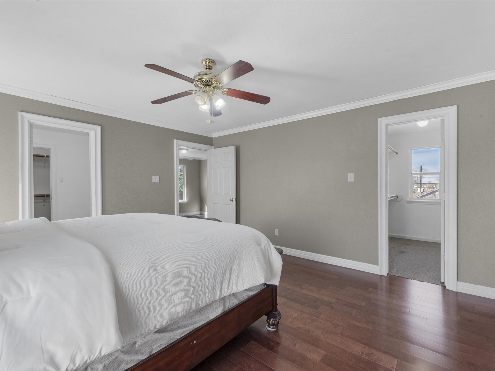8906 Intervale Street Houston, TX 77075 - Photo 9 of 21 a bedroom with a large bed and wooden floor