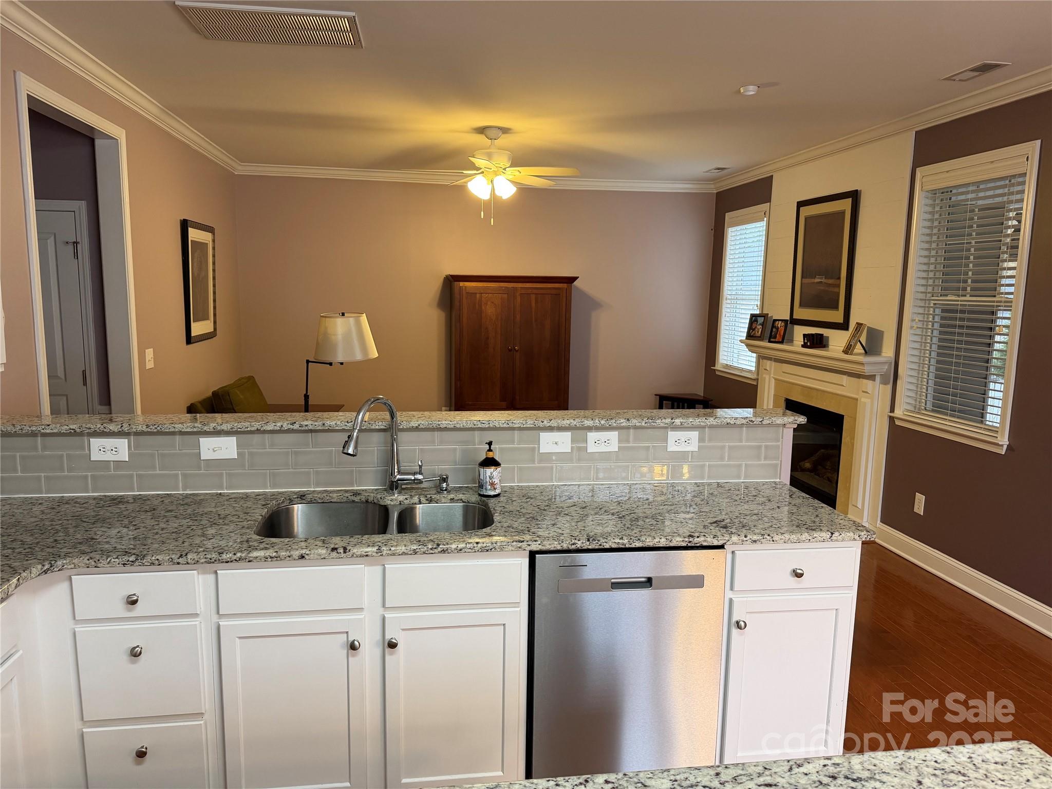10219 Caldwell Depot Road Cornelius, NC 28031 - Photo 20 of 42 a bathroom with a granite countertop double vanity sink a mirror and vanity
