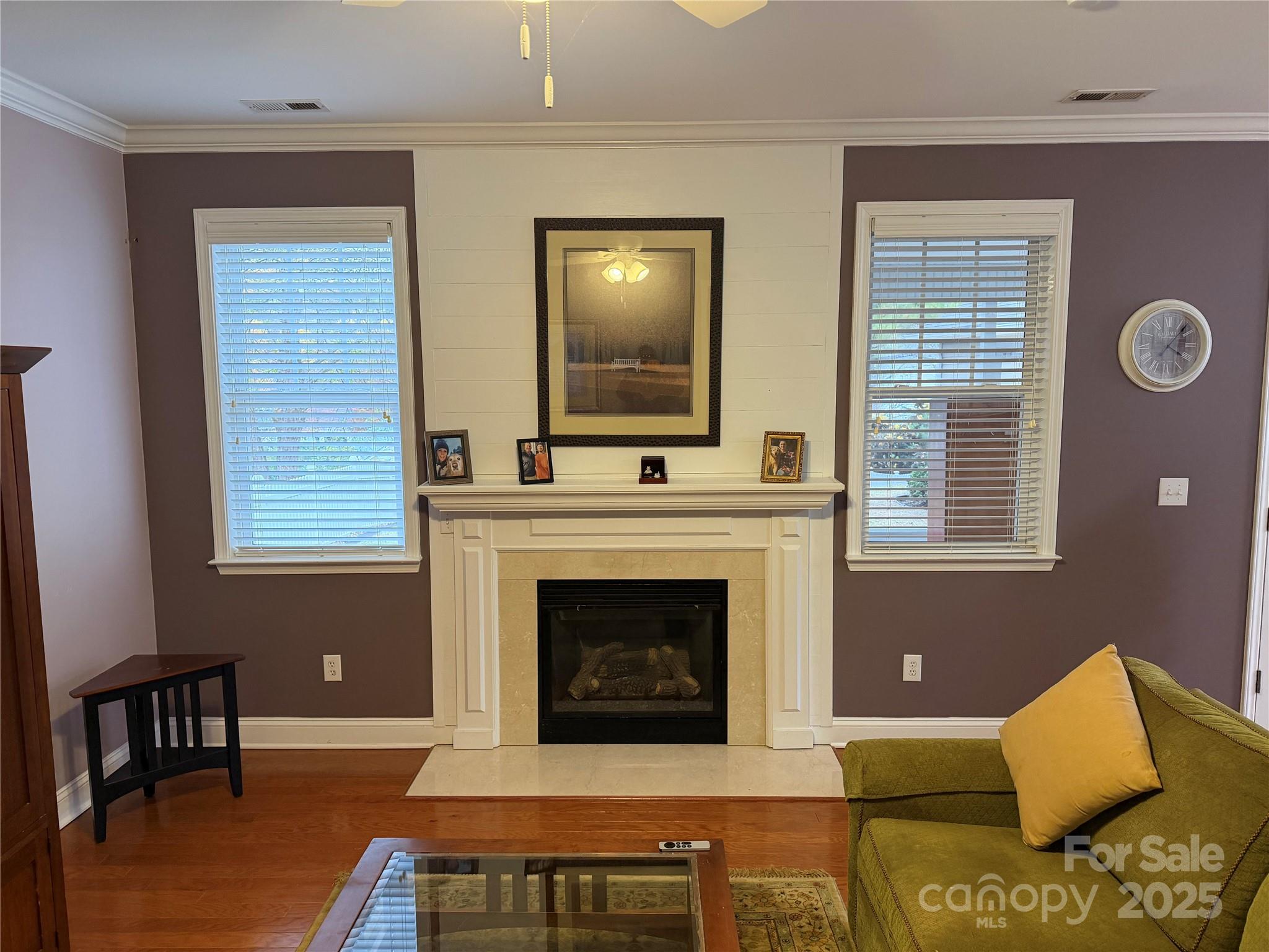 10219 Caldwell Depot Road Cornelius, NC 28031 - Photo 29 of 42 a living room with furniture and a fireplace