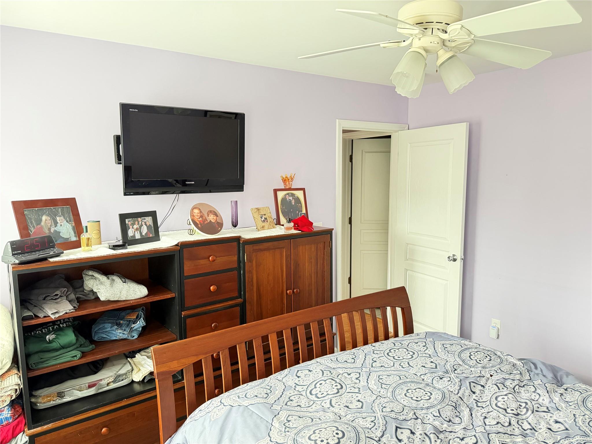 10219 Caldwell Depot Road Cornelius, NC 28031 - Photo 35 of 42 a bedroom with furniture and a flat screen tv