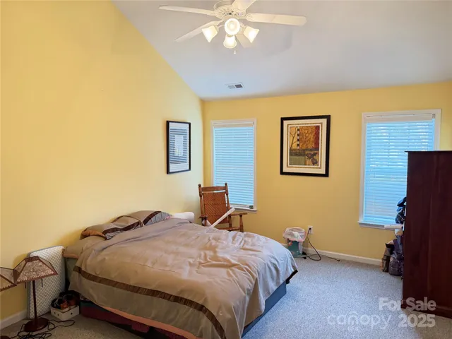 a bedroom with a bed and chair