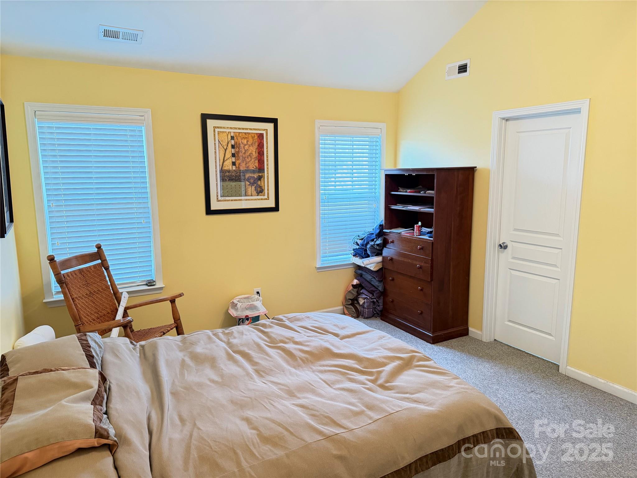 10219 Caldwell Depot Road Cornelius, NC 28031 - Photo 40 of 42 a bedroom with a bed and chair