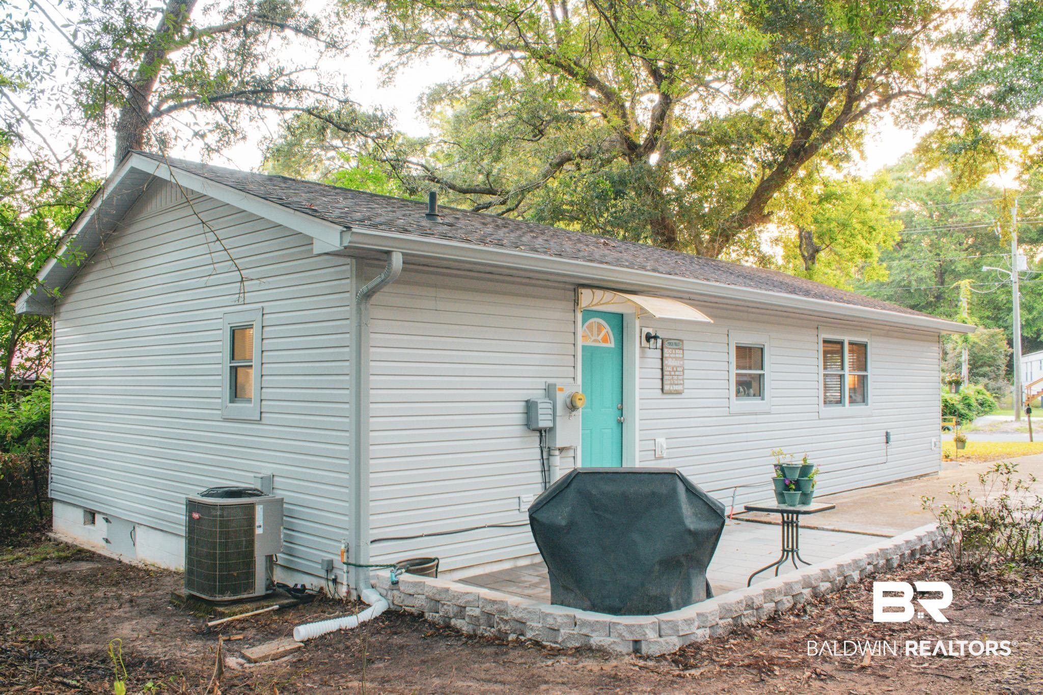 1563 Valencia Drive Lillian, AL 36549 - Photo 25 of 27 Rear view of property with a shingled roof and a patio
