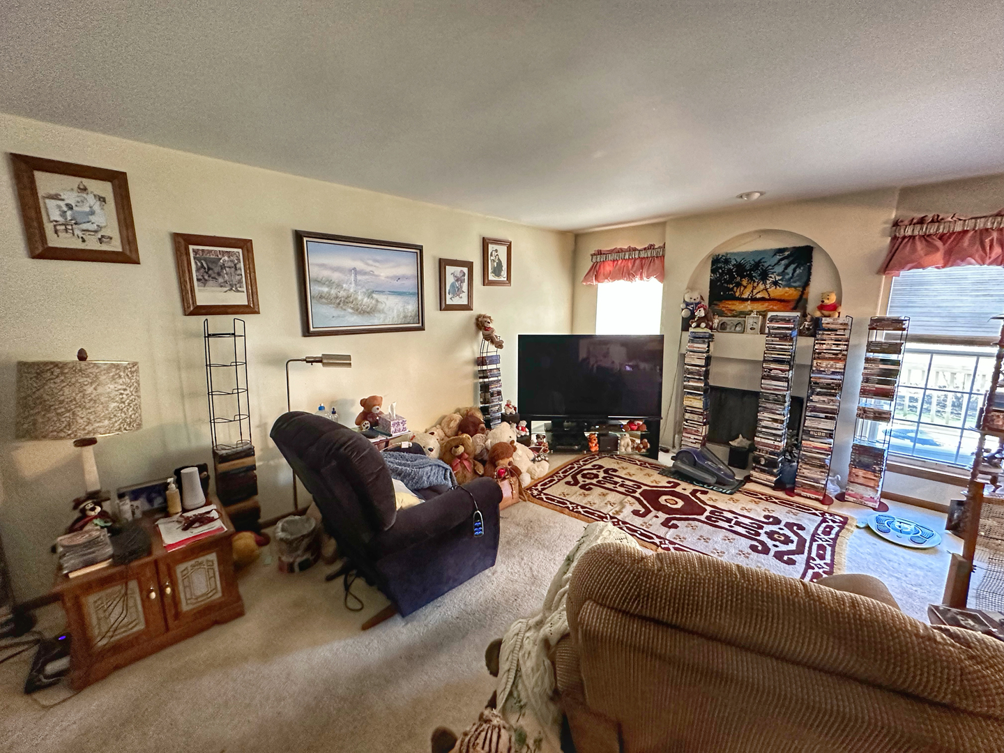 306 Cane Garden Circle Aurora, IL 60504 - Photo 4 of 13 a living room with furniture a flat screen tv and a fireplace
