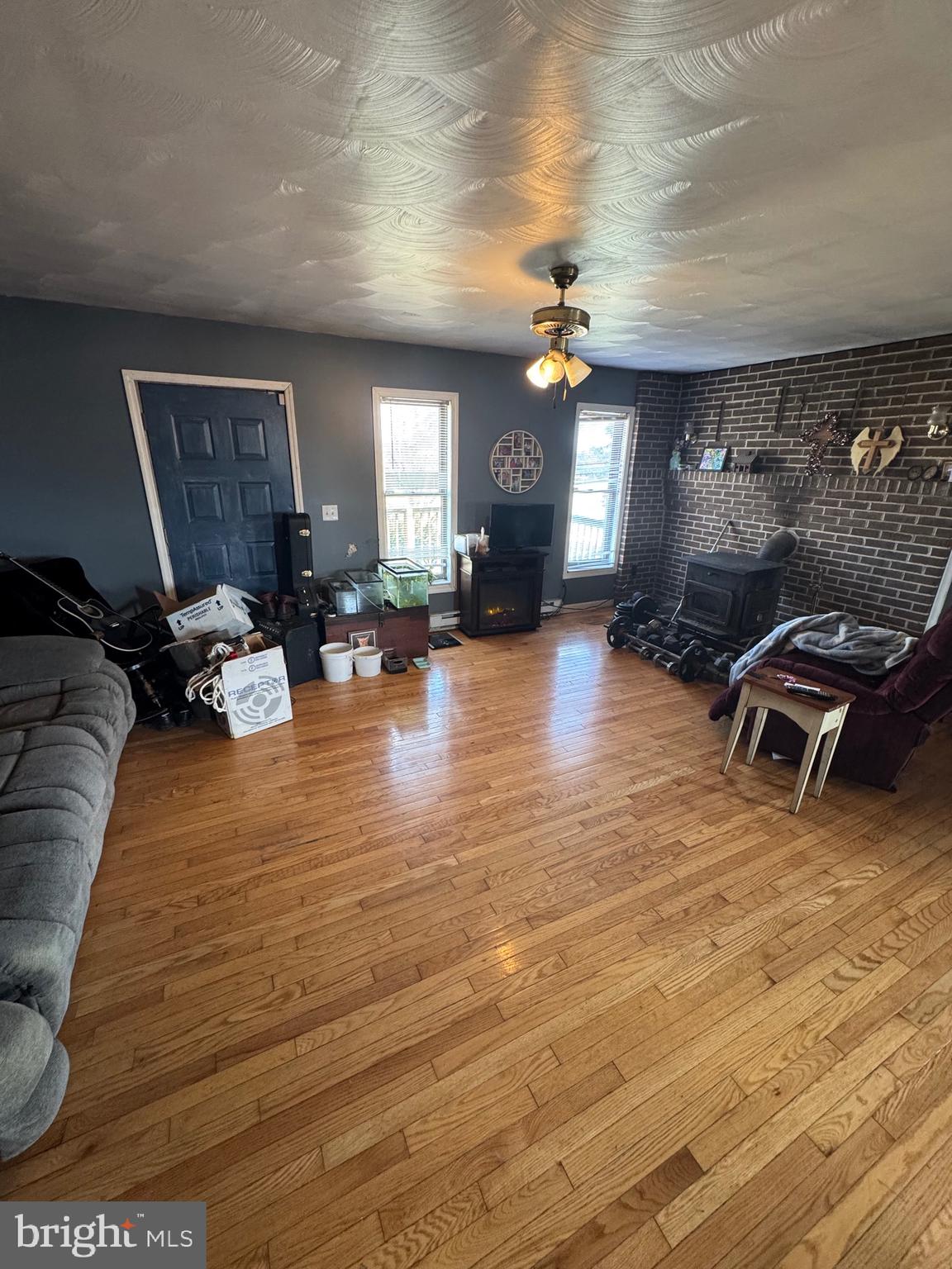 878 Hatchery Road Inwood, WV 25428 - Photo 119 of 131 a living room with furniture and a wooden floor