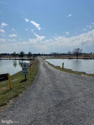 a view of a house with a yard and garage