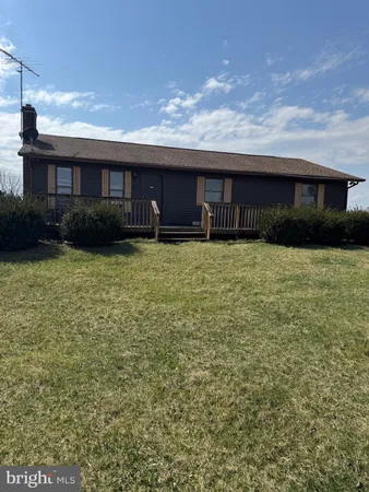 a view of a balcony with wooden floor and city view