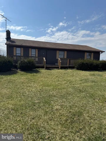 a view of a balcony with wooden floor and city view