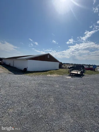 a view of a livingroom with furniture and a fireplace
