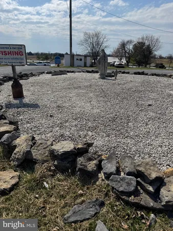 a view of living room with furniture and wooden floor
