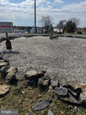 a view of living room with furniture and wooden floor
