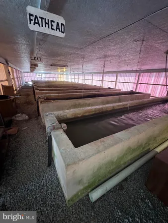 a bedroom with furniture and a flat screen tv