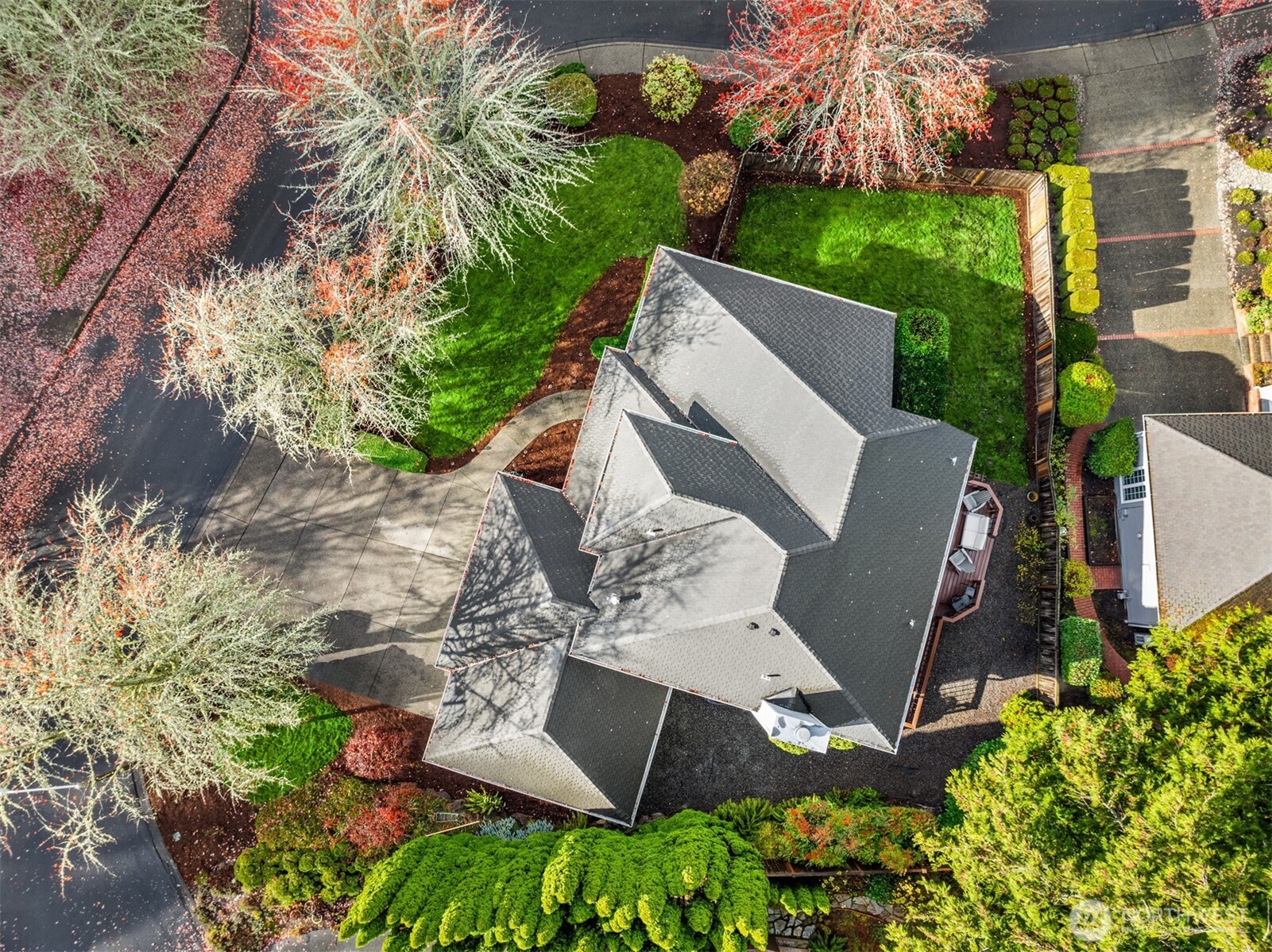 10330 Northeast 151st Place Bothell, WA 98011 - Photo 2 of 38 an aerial view of a house with a yard and garden