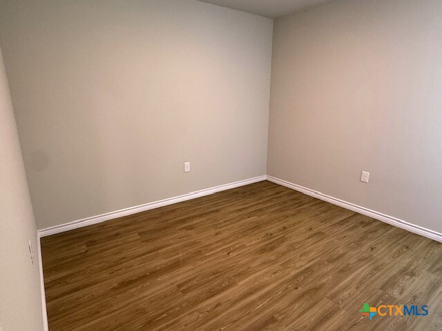 2410 Westcliff Road, Unit A Killeen, TX 76543 - Photo 20 of 22 a view of an empty room with wooden floor