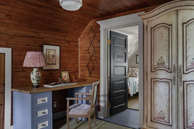 a view of workspace with wooden wall