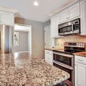 307 Raintree Drive Hendersonville, TN 37075 - Photo 12 of 42 a kitchen with stainless steel appliances and cabinets