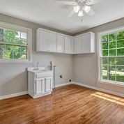 307 Raintree Drive Hendersonville, TN 37075 - Photo 16 of 42 a view of a kitchen with wooden floor and a window