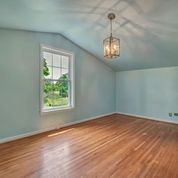 307 Raintree Drive Hendersonville, TN 37075 - Photo 22 of 42 an empty room with wooden floor chandelier and windows