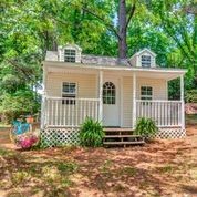 307 Raintree Drive Hendersonville, TN 37075 - Photo 29 of 42 a view of a house with a small yard and large trees