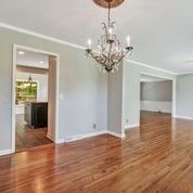 307 Raintree Drive Hendersonville, TN 37075 - Photo 6 of 42 a view of a big room with wooden floor chandeliers and kitchen view