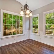307 Raintree Drive Hendersonville, TN 37075 - Photo 7 of 42 a view of an empty room with wooden floor and a window