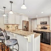 307 Raintree Drive Hendersonville, TN 37075 - Photo 9 of 42 a kitchen with kitchen island granite countertop a sink a center island and cabinets