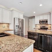 307 Raintree Drive Hendersonville, TN 37075 - Photo 10 of 42 a kitchen with kitchen island granite countertop a stove sink and cabinets