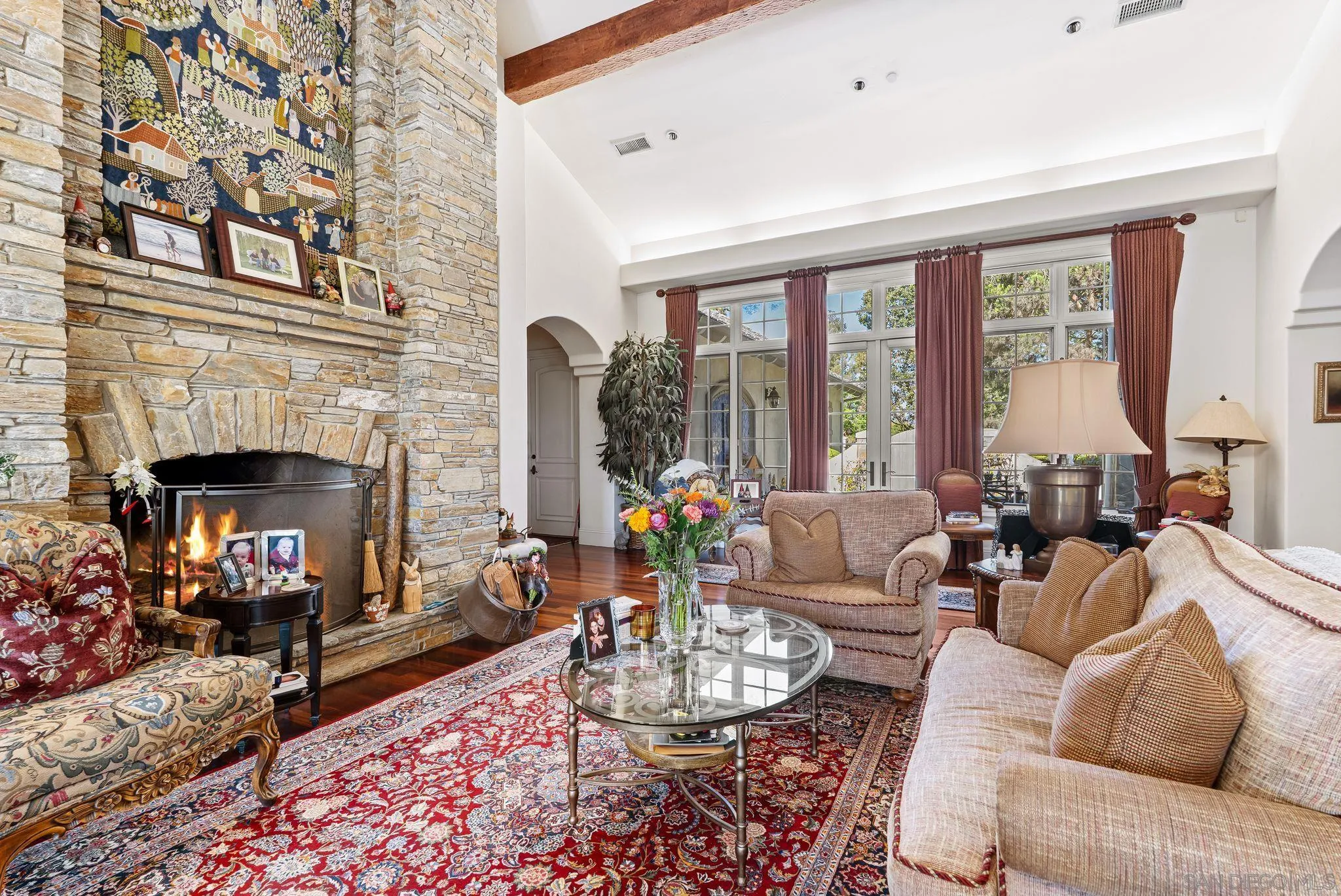 14786 Rancho Santa Fe Farms Road Rancho Santa Fe, CA 92067 - Photo 14 of 49 a living room with furniture fireplace and a large window