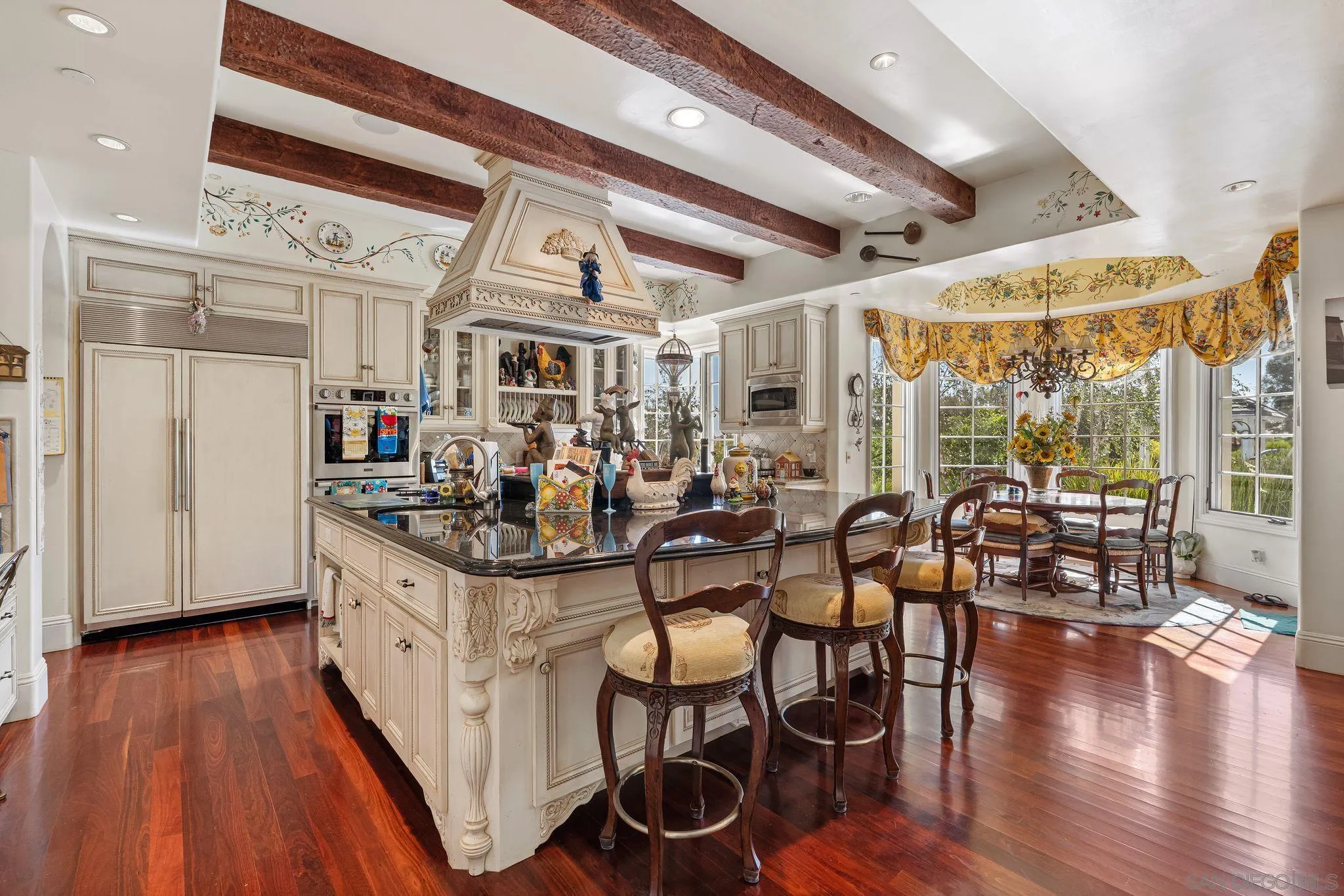 14786 Rancho Santa Fe Farms Road Rancho Santa Fe, CA 92067 - Photo 15 of 49 a kitchen with stainless steel appliances granite countertop a stove and wooden floor