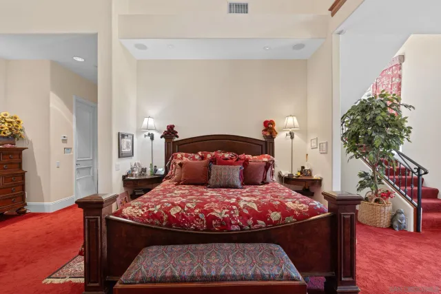 a bedroom with a bed and a table in it