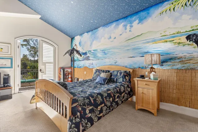 a bed room with a bed and a baby crib