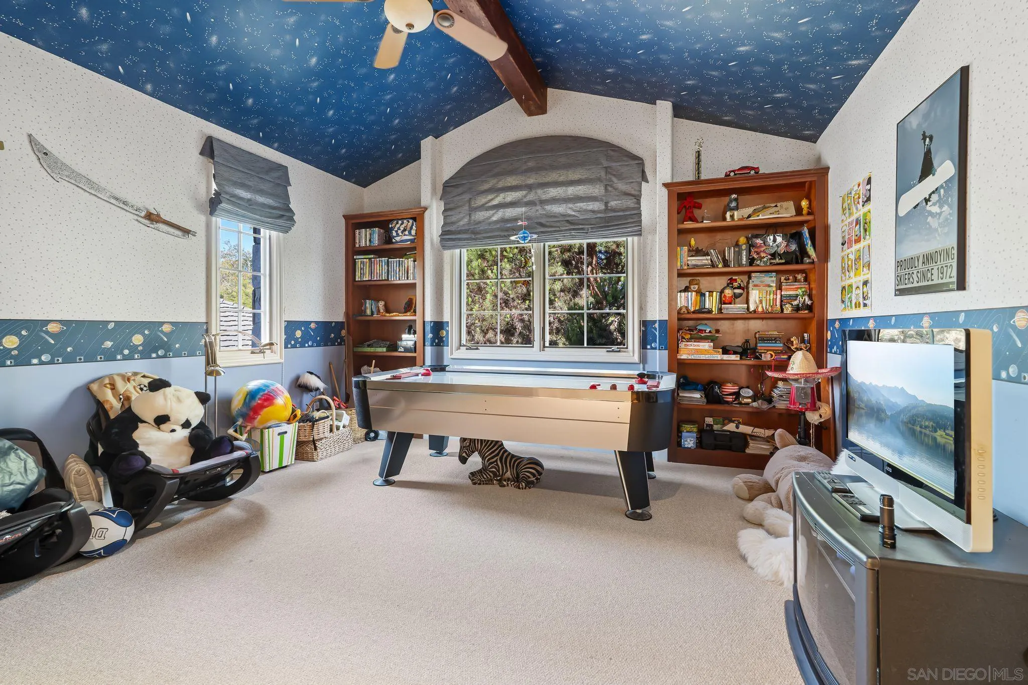 14786 Rancho Santa Fe Farms Road Rancho Santa Fe, CA 92067 - Photo 28 of 49 a living room with patio furniture and a flat screen tv