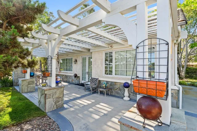 a living room with furniture a rug and a large window