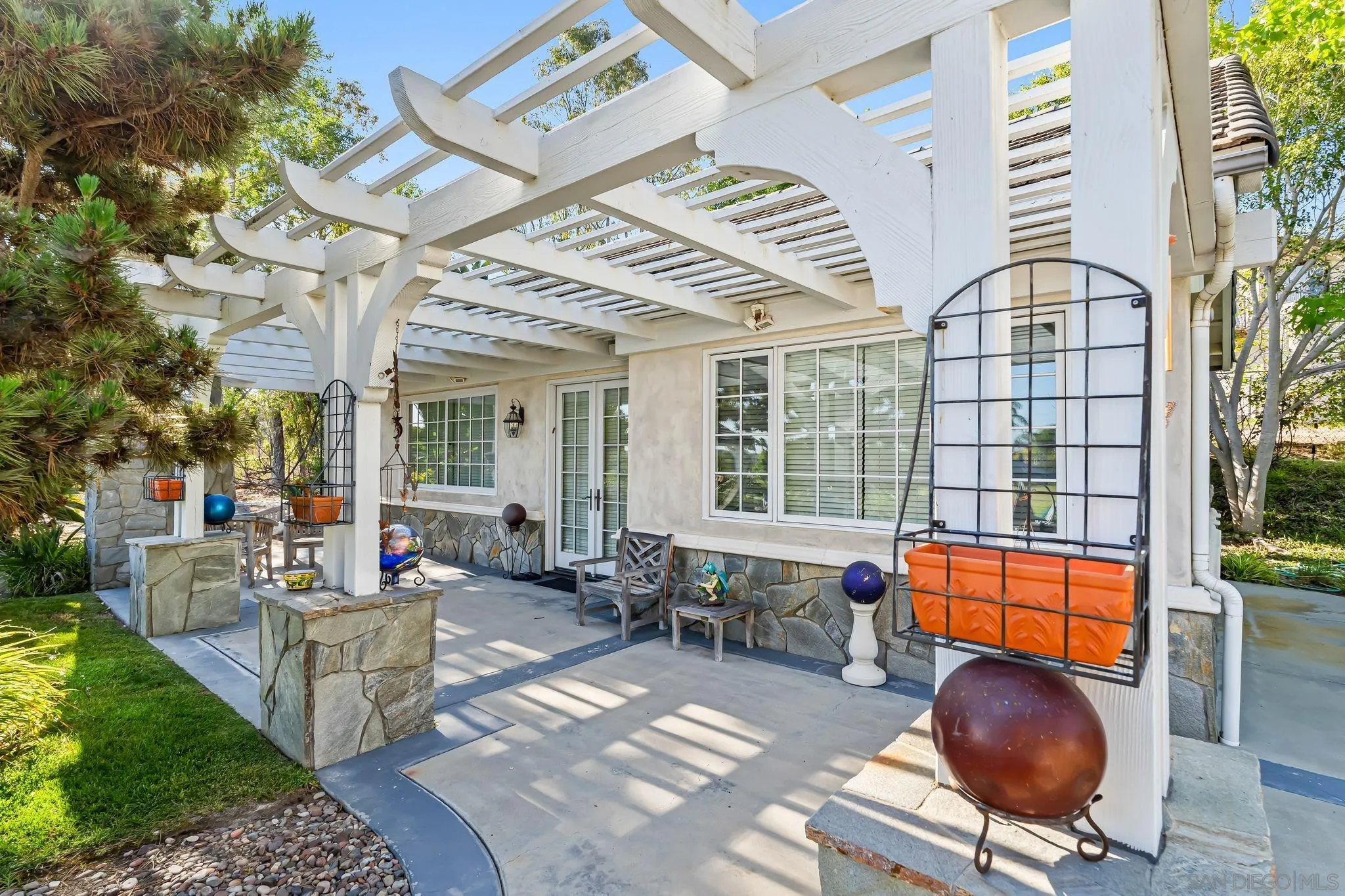 14786 Rancho Santa Fe Farms Road Rancho Santa Fe, CA 92067 - Photo 32 of 49 a living room with furniture a rug and a large window