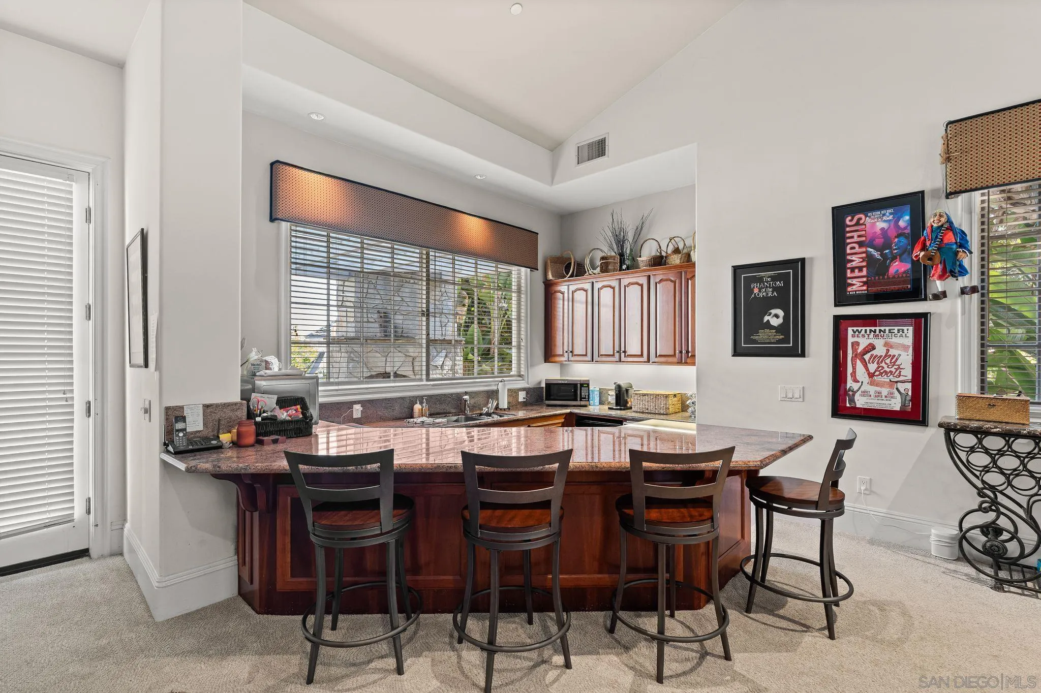 14786 Rancho Santa Fe Farms Road Rancho Santa Fe, CA 92067 - Photo 36 of 49 a view of a dining room with furniture