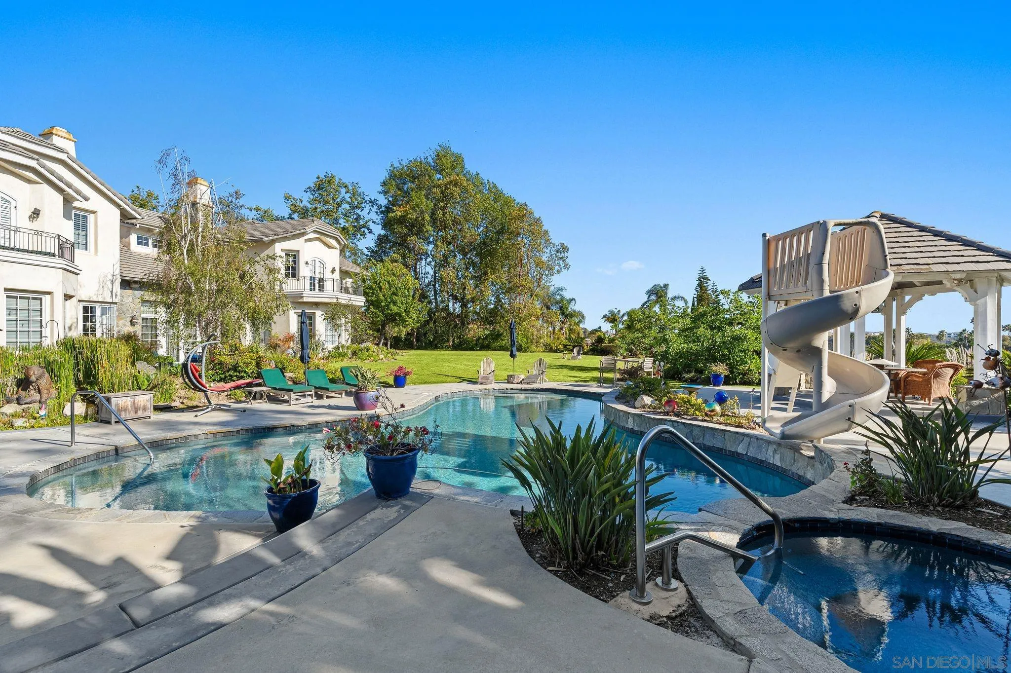 14786 Rancho Santa Fe Farms Road Rancho Santa Fe, CA 92067 - Photo 41 of 49 a front view of multiple houses with yard