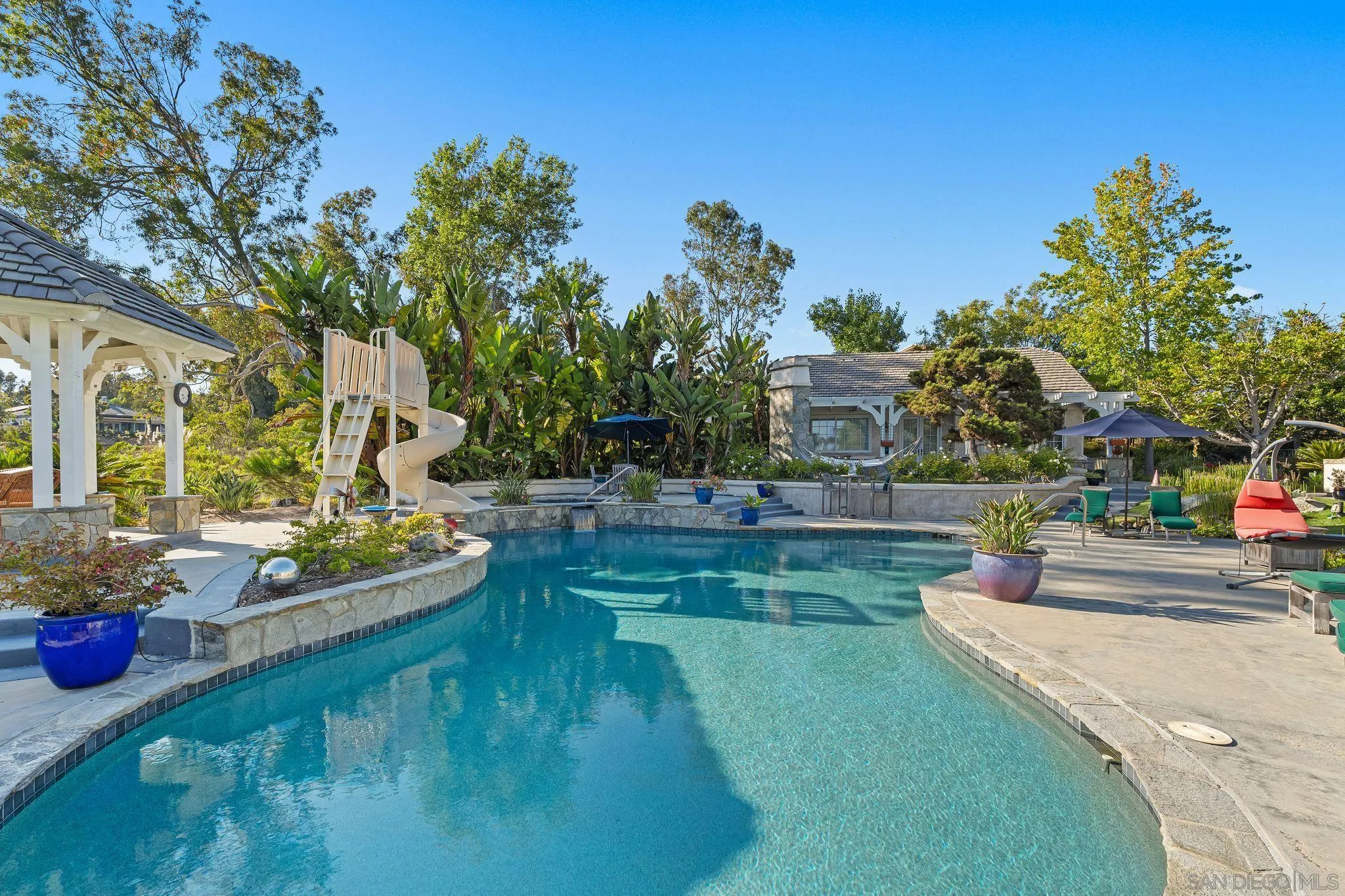 14786 Rancho Santa Fe Farms Road Rancho Santa Fe, CA 92067 - Photo 44 of 49 a view of a house with a yard