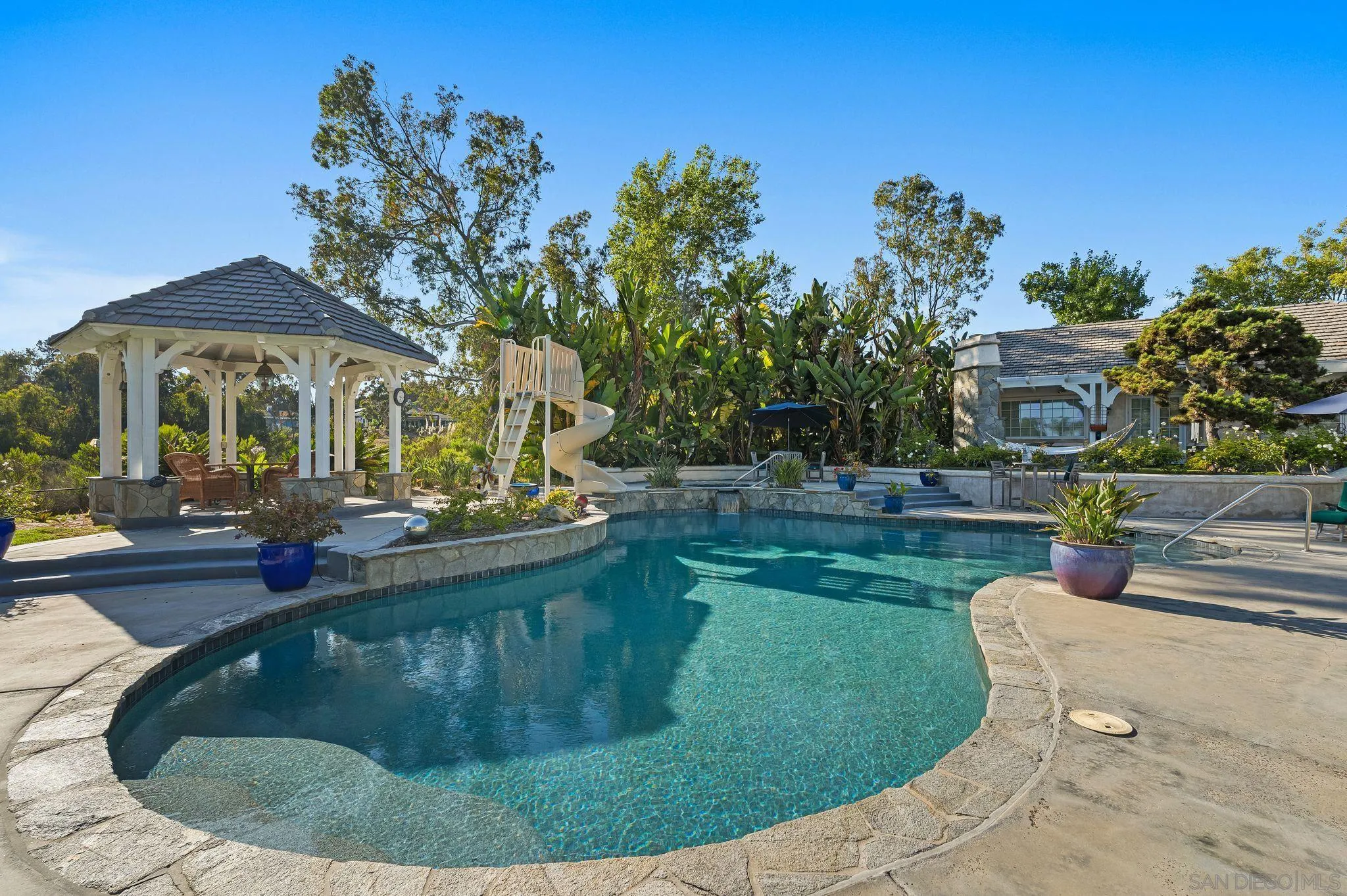 14786 Rancho Santa Fe Farms Road Rancho Santa Fe, CA 92067 - Photo 45 of 49 a view of a house with swimming pool